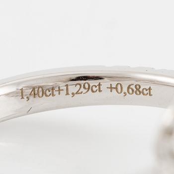 Crossover ring, 18K white gold set with pear-shaped and emerald-cut diamonds. Accompanied by GIA report.