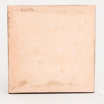 A CERAMIC WALL RELIEF.