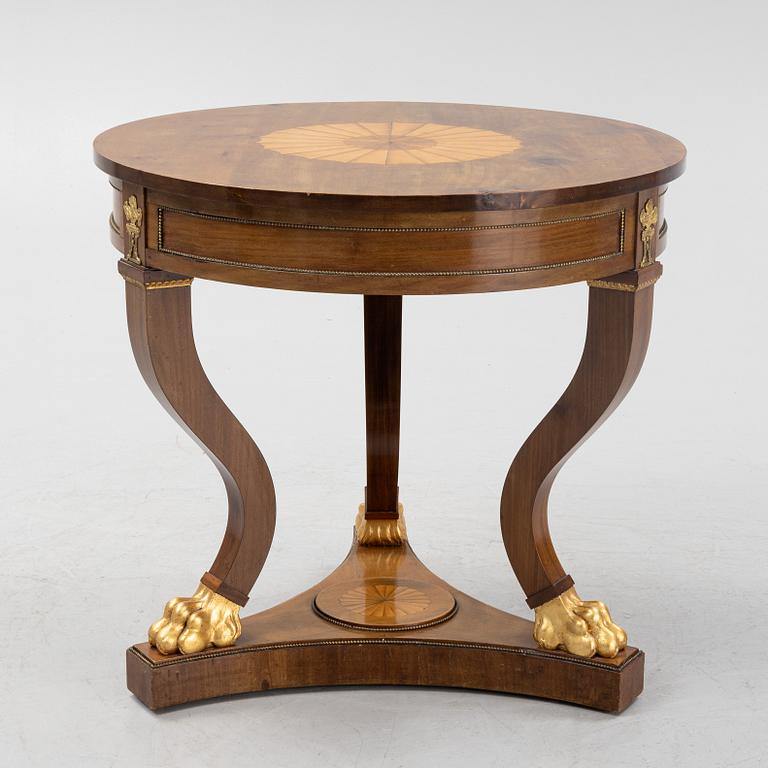 An empire style mahogany table, around 1900.