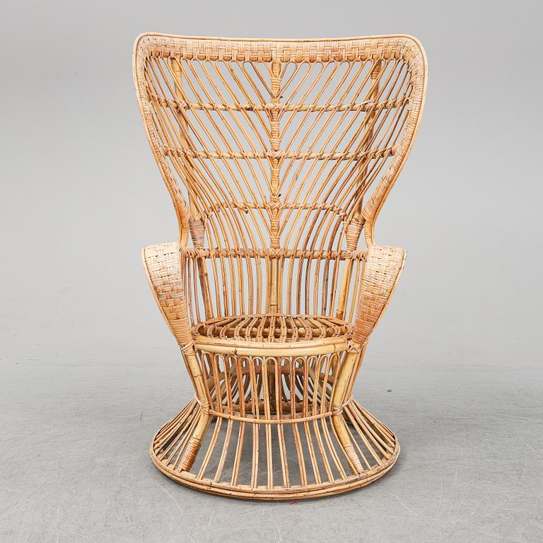 GIO PONTI & LIO CARMINATI, A 'Conte Biancamano' rattan Wingback Armchair for Bonacina, Italy.
