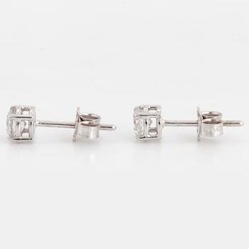 Brilliant-cut diamond stud earrings.