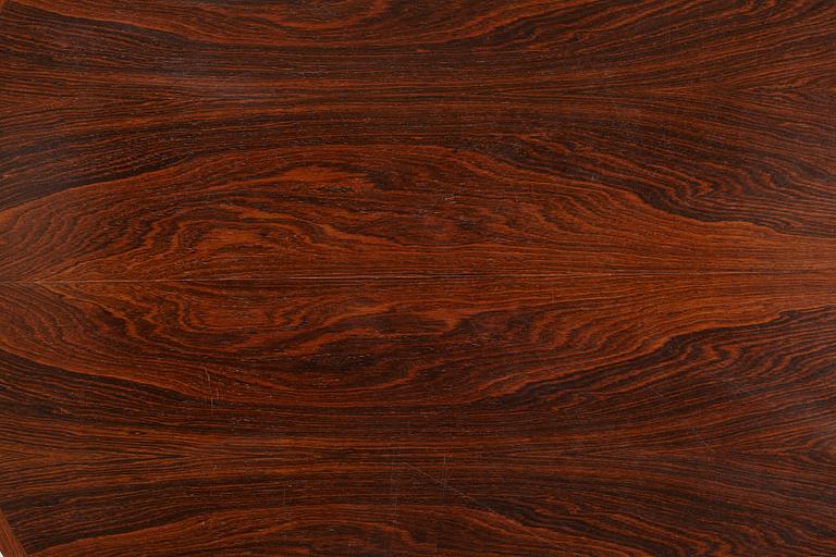 Niles Otto Møller, a rosewood veneered table with four chairs, JL Møller, Denmark, 1950's/60's.