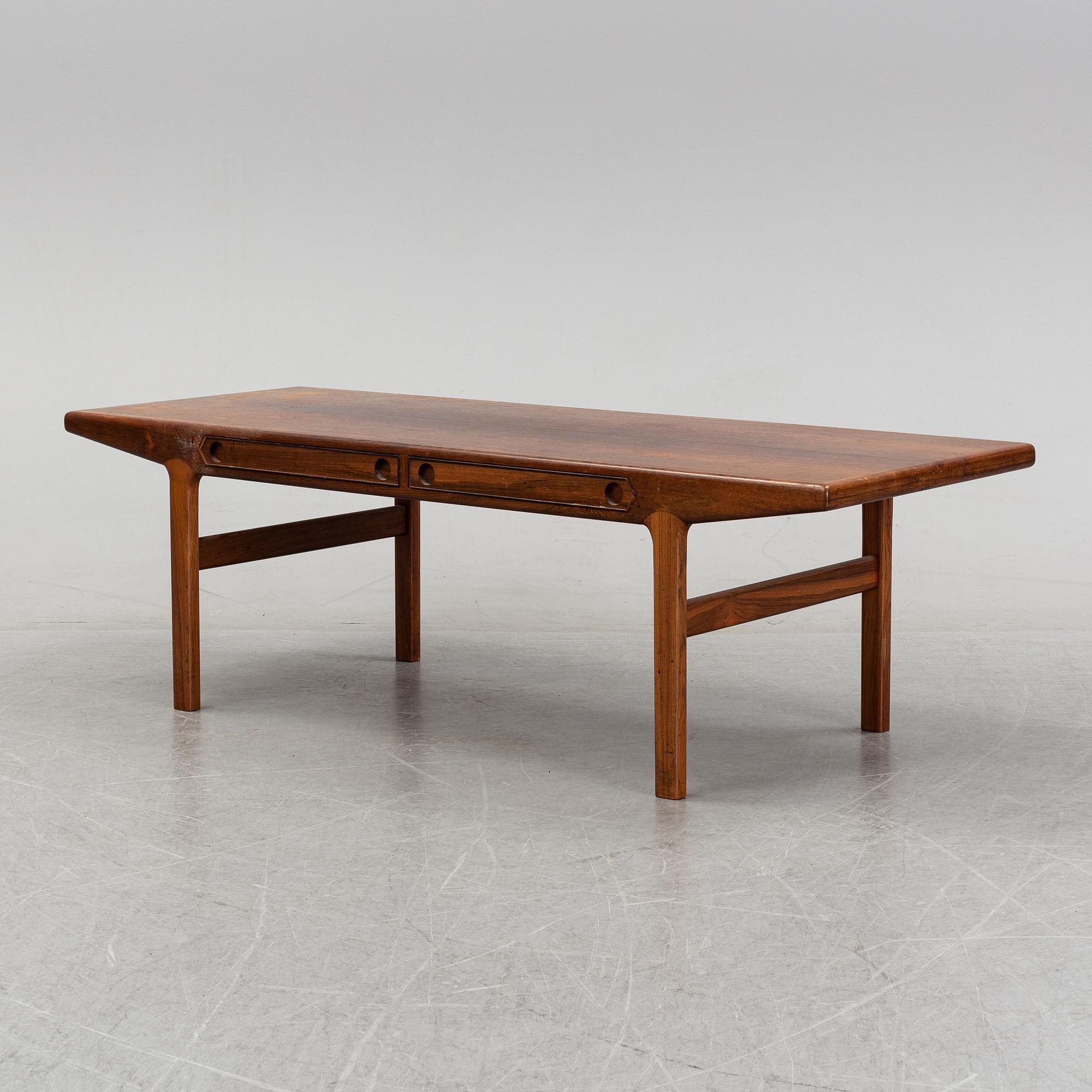 A 1950's/60's rosewood veneered coffee table.