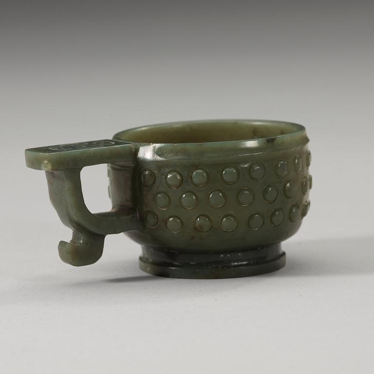 A Chinese archaistic carved nephrite cup.