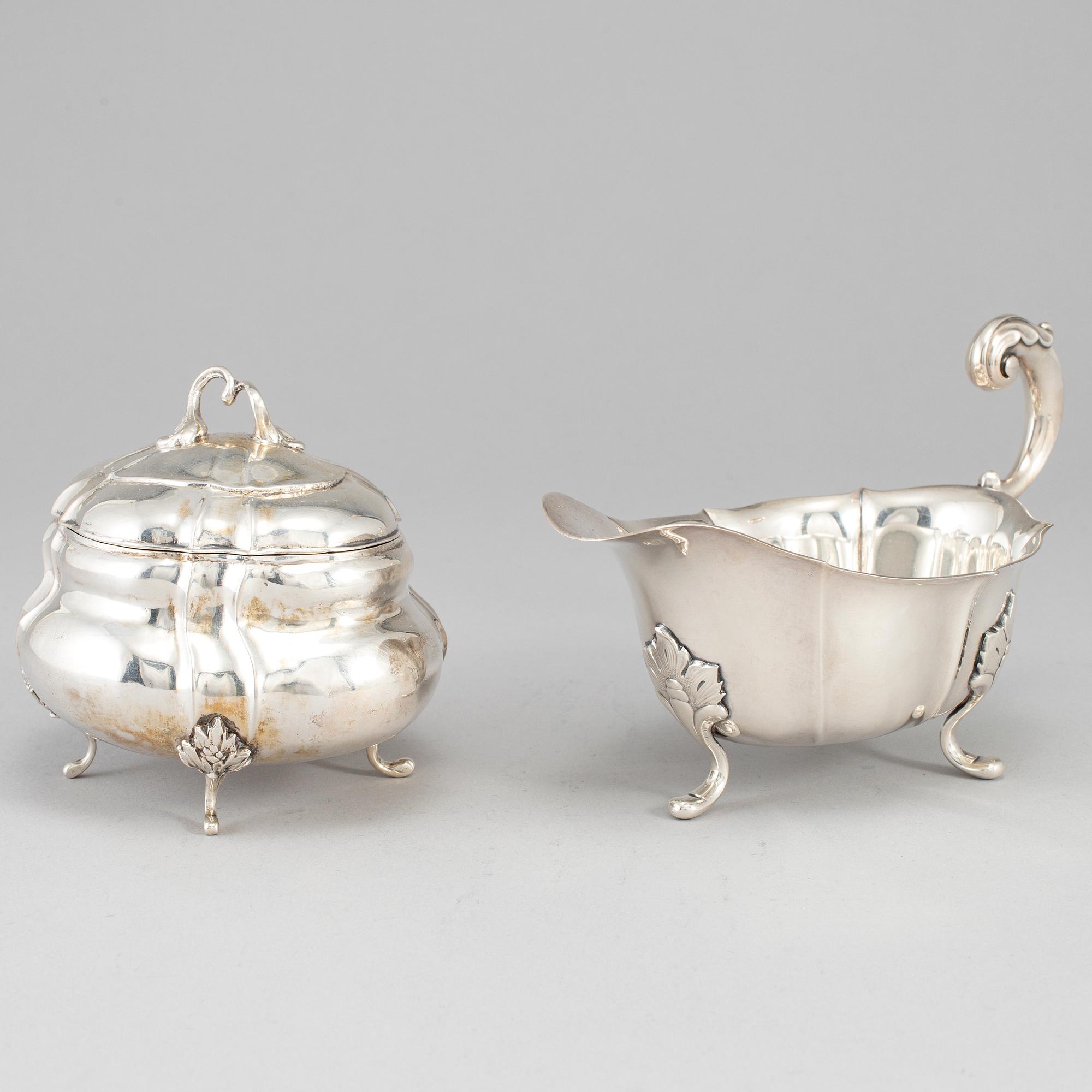 A rococo-style 20th century silver cream-jug and sugar-box, Swedish import marks.