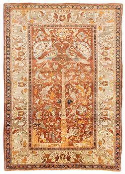 An antique silk Tabriz carpet, north west Persia, c 239 × 168 cm.