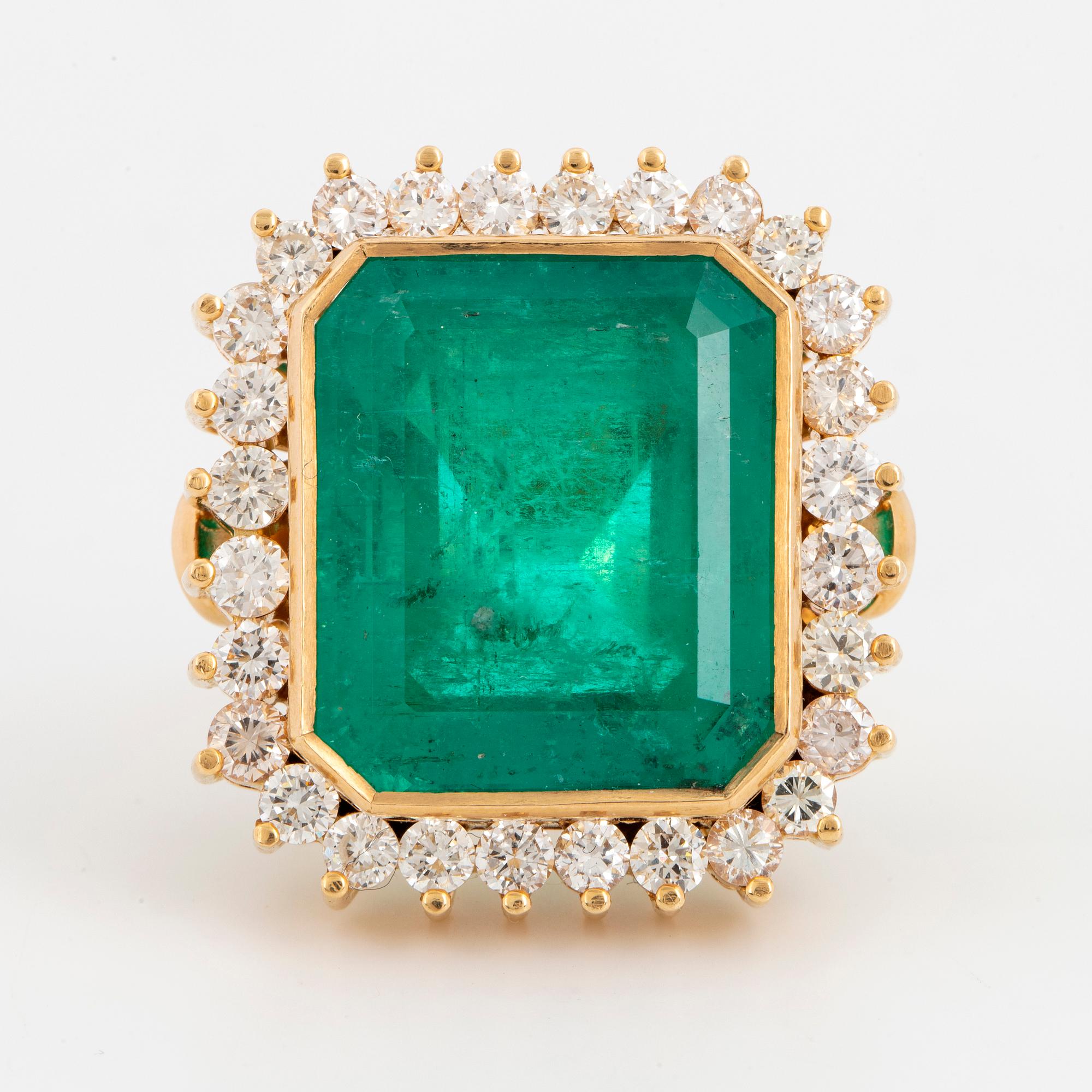Large emerald-cut emerald and brilliant-cut diamond cocktail ring.