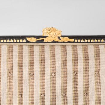 A gustavian style table and sofa, around the year 1900.