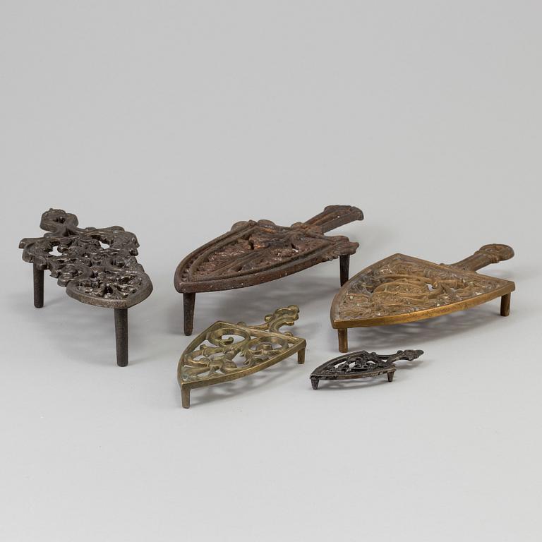 A set of five iron stands, circa 1900.