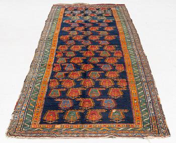 An Oriental runner carpet, circa 347 x 108 cm.