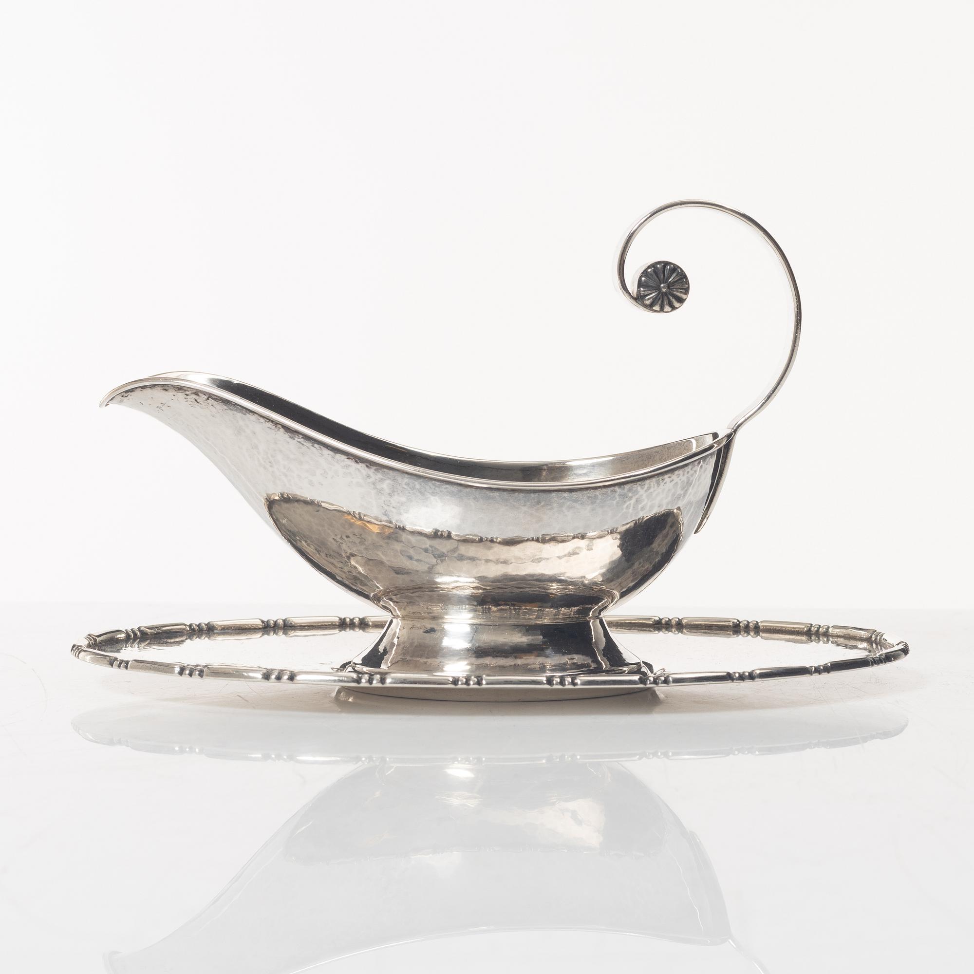 A Swedish silver sauce boat, marks of C.G. Hallberg, Stockholm 1926.