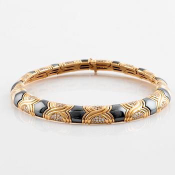 A Bulgari 18K gold and hematite necklace set with round brilliant-cut diamonds.