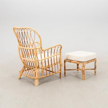 Josef Frank, wicker chair with stool model no. B 311 for Svenskt Tenn, second half of the 20th century.