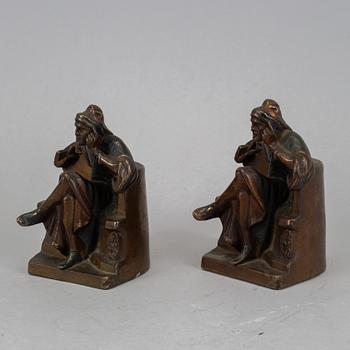 Two brass book ends, 20th century.