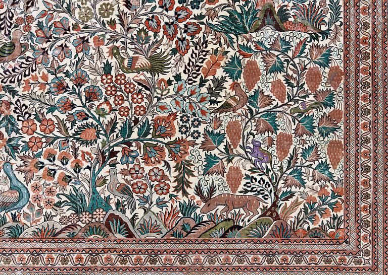 An oriental pictoral silk rug, approx. 280 x 183 cm.