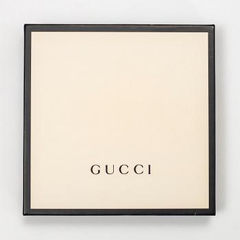 Gucci, a 'Flora' silk scarf.