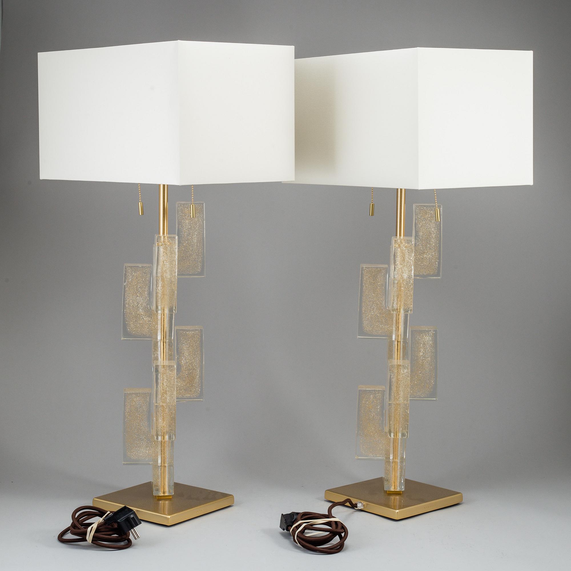 A 'Esha Alta' glass and brass table lamp from Donghia lightning.