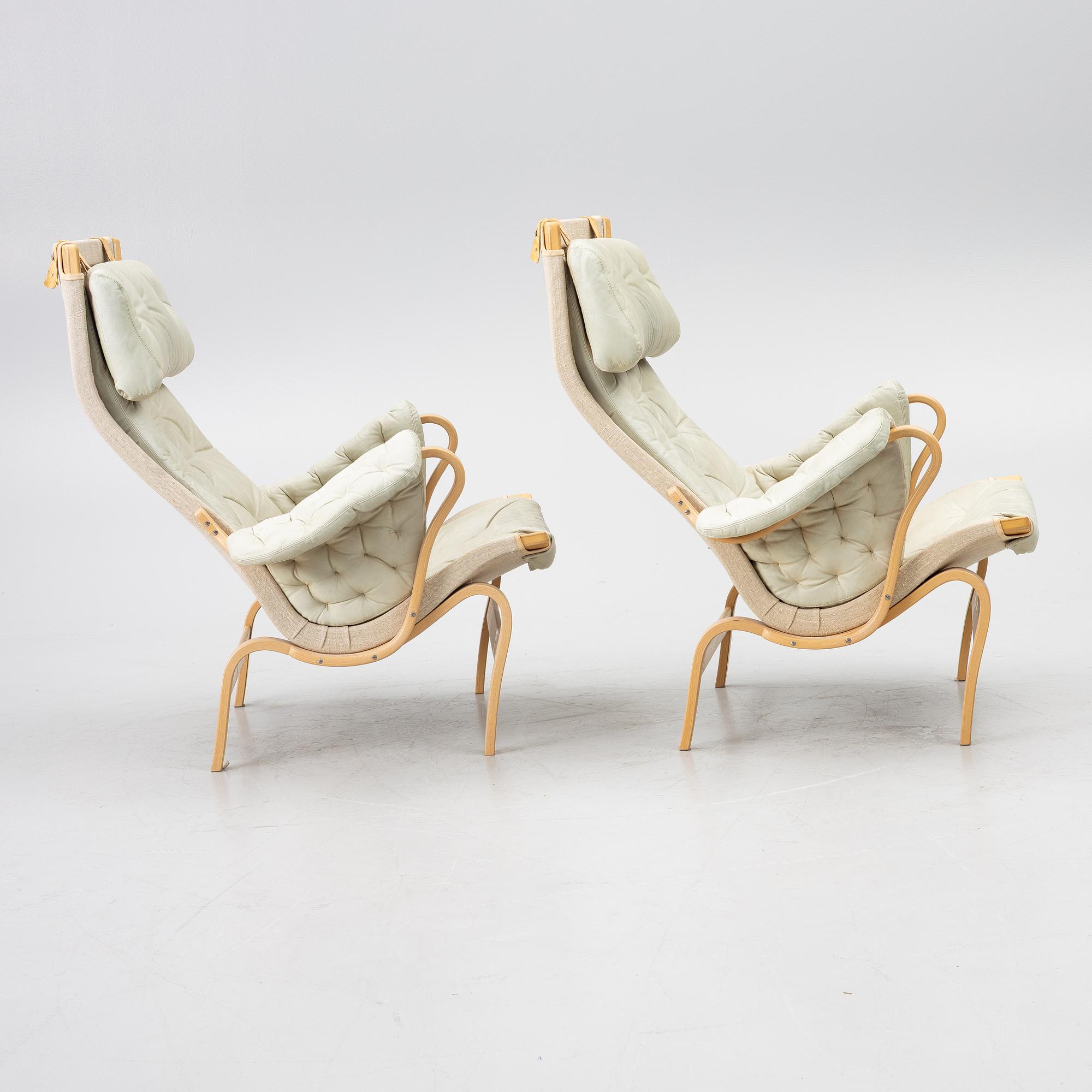 Bruno Mathsson, a pair of 'Pernilla' armchairs, Dux, Sweden, later part of the 20th century.