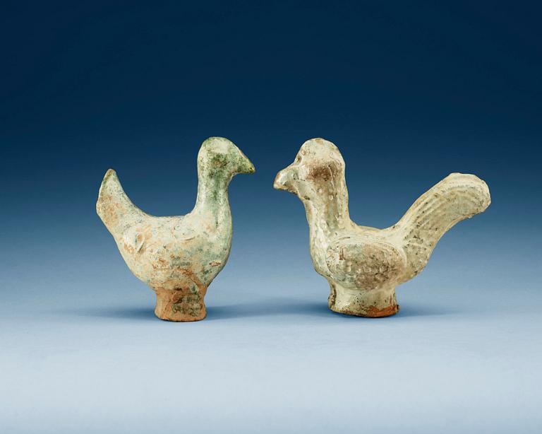 A set of two green glazed pottery models of a rooster and a hen, Han dynasty (206 BC- 220 AD).