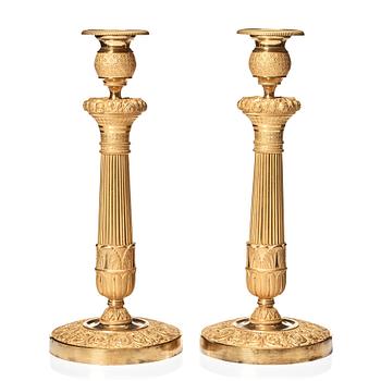 120. A pair of French Empire candlesticks, beginning of the 1800's.