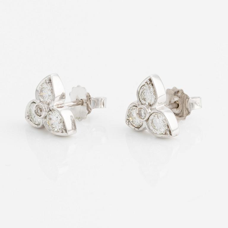 A pair of 18K white gold earrings with round brilliant-cut diamonds.