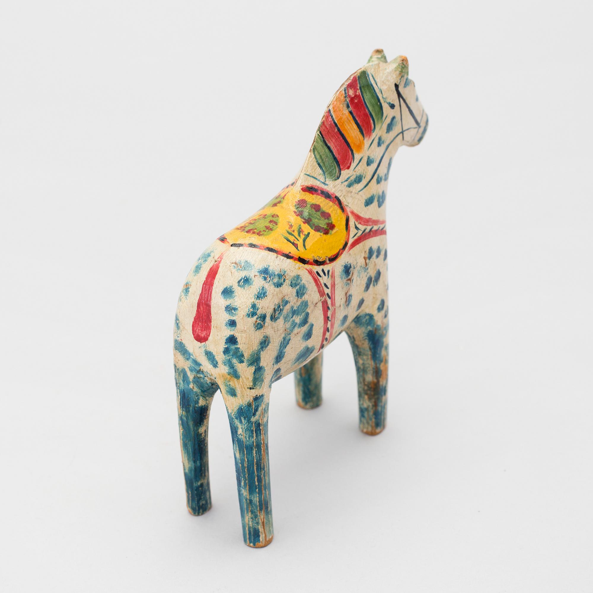 A painted folk art dala horse first half of the 20th century.