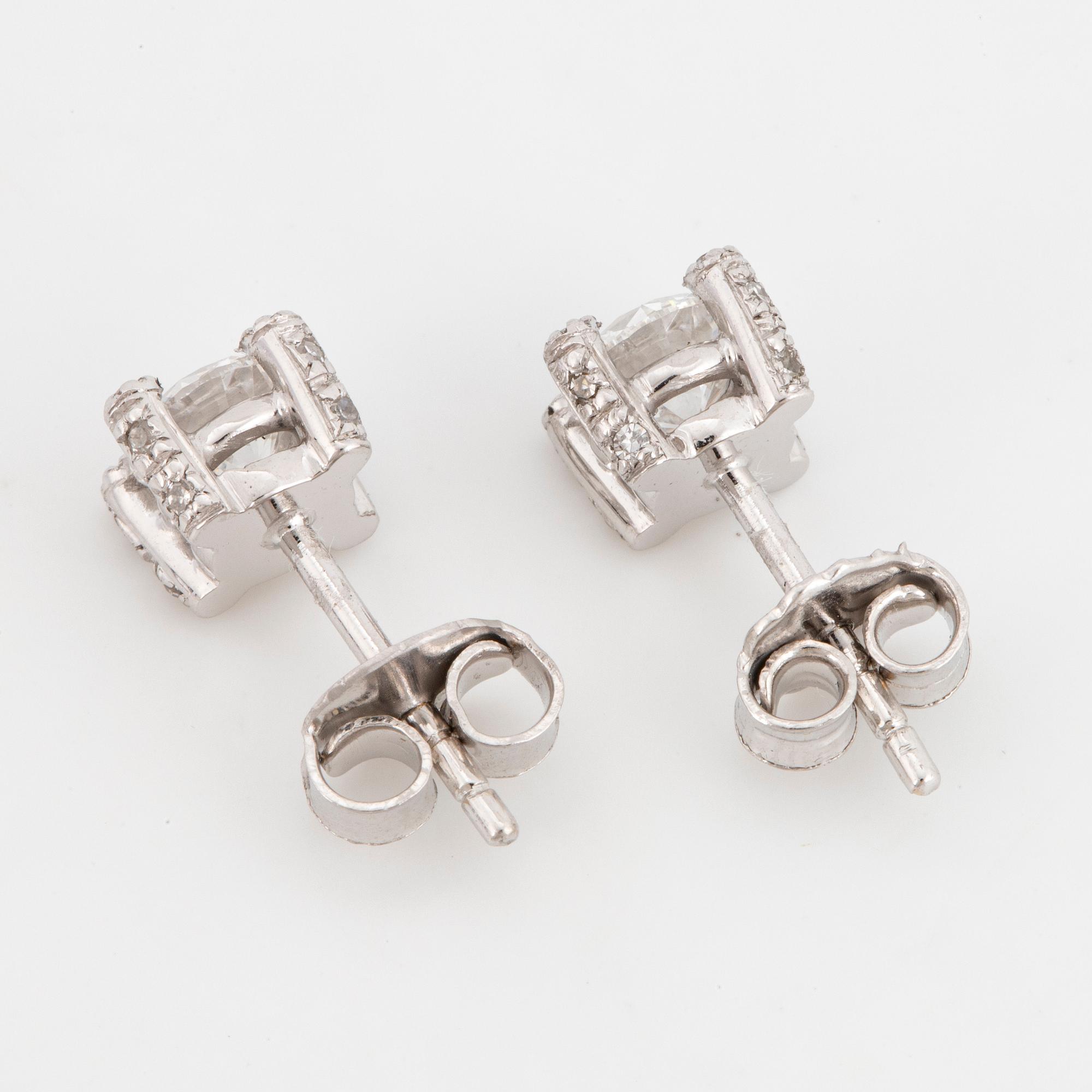 Brilliant-cut diamond stud earrings.