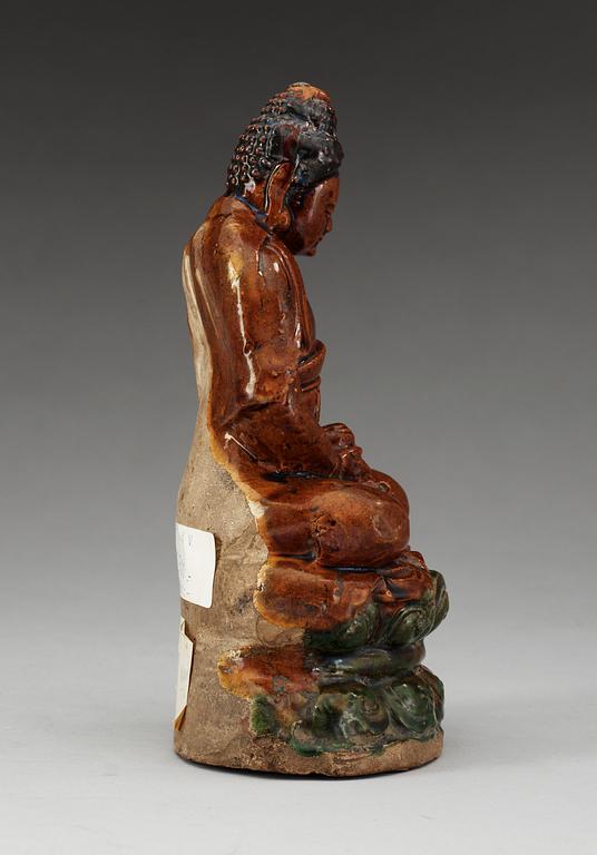 A ceramic figure of Buddha, Ming dynasty, 17th Century.
