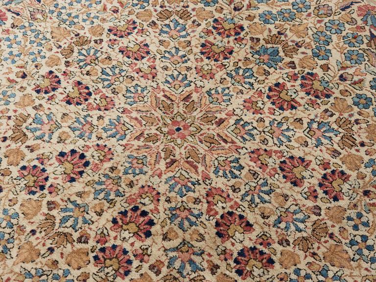 A semi-antique/old Kerman carpet, around 361 x 264 cm.