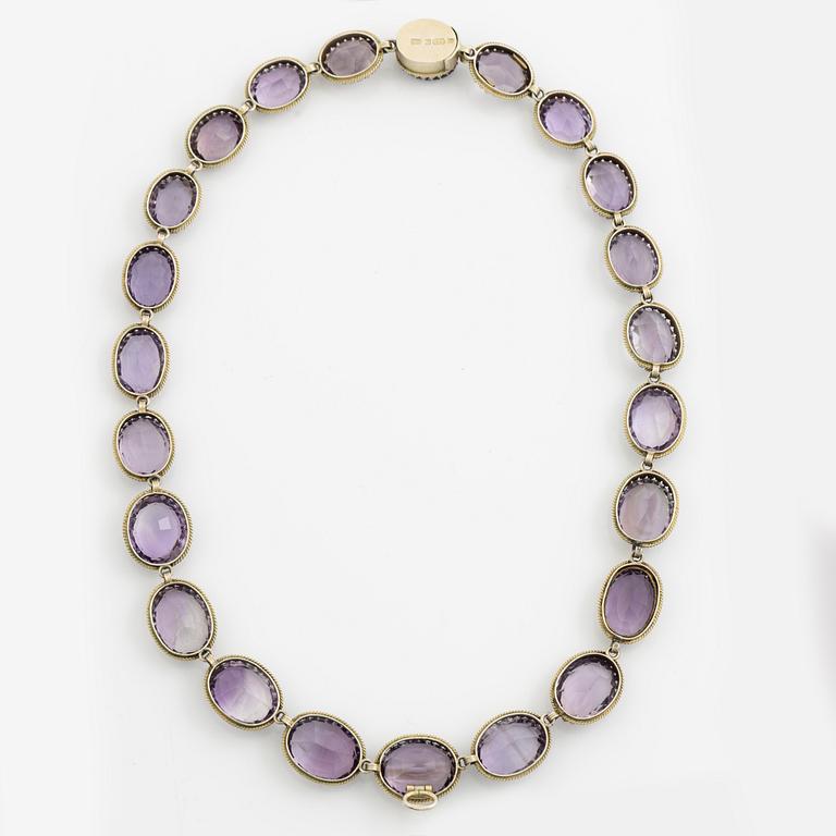 Garniture, necklace and bracelet silver with amethysts, brooch gold-coloured metal with purple paste stones,