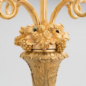 A latter half of the 19th-century candelabrum/ table light, altered in the 20th century.