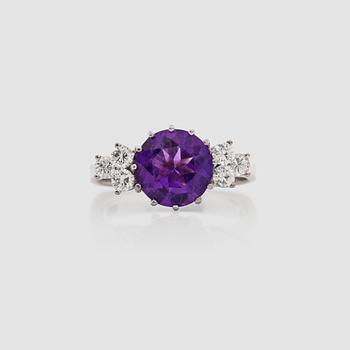 An amethyst and brilliant-cut diamond ring. Total carat weight of diamonds circa 0.50 cts.