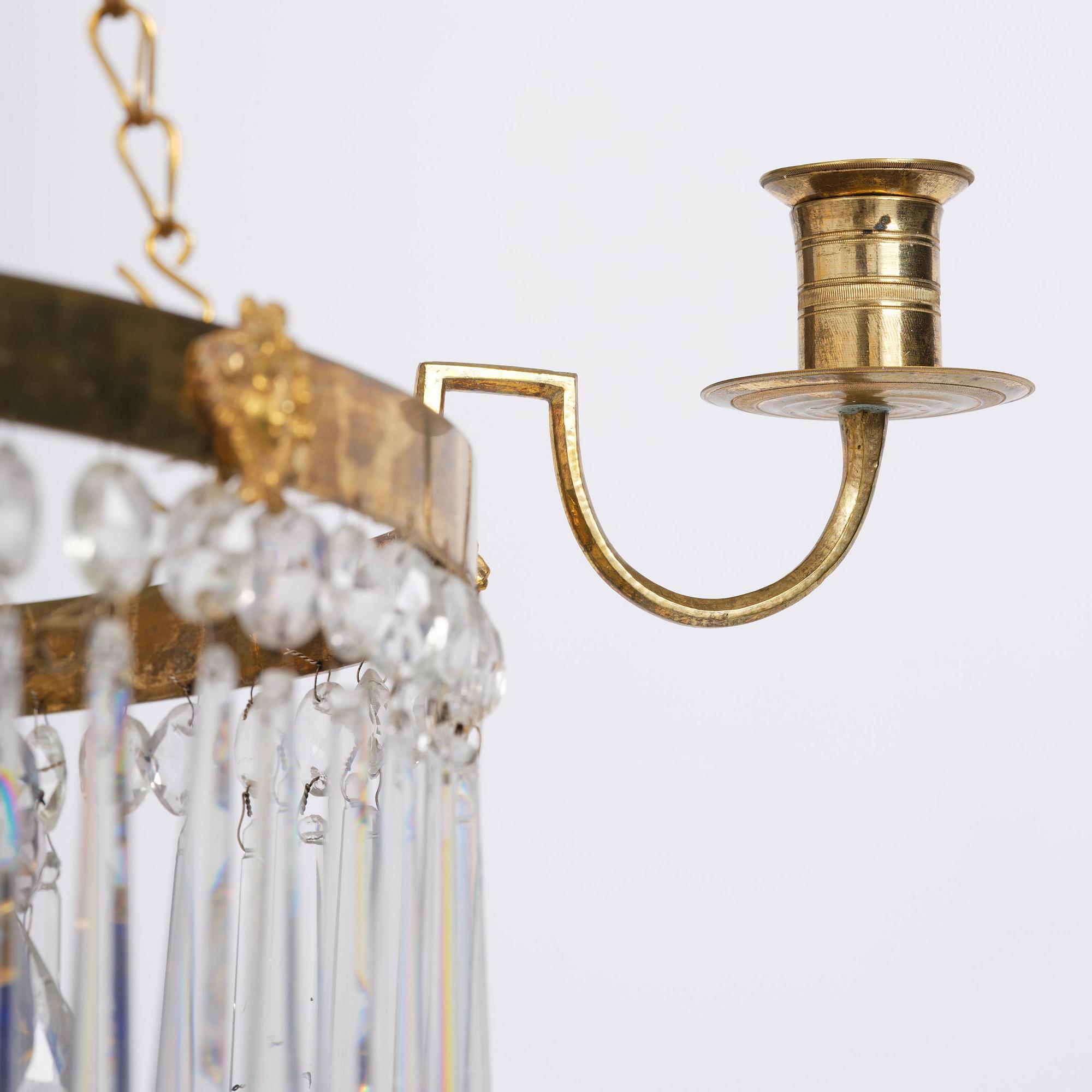 A late Gustavian five-light gilt brass and cut glass chandelier, Stockholm, late 18th century.