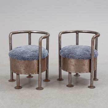A pair of steel chairs by Arpad Földessy, 21st Century.