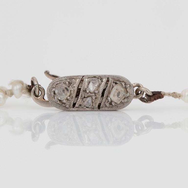 A seed pearl and turquoise bead necklace.