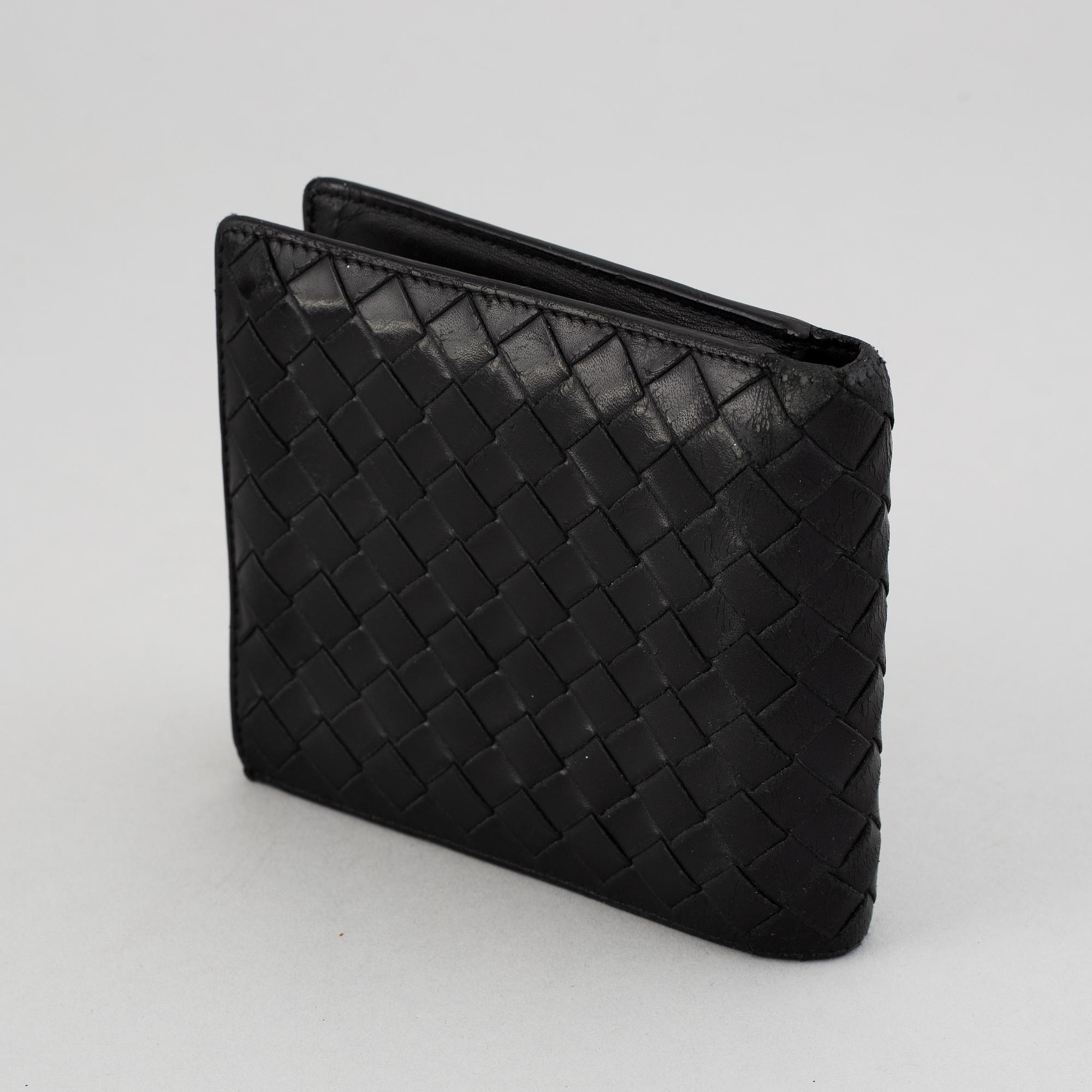 Bottega veneta, a black leather wallet.