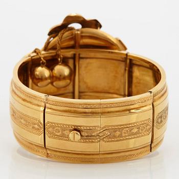 An 18K gold Möllenborg bracelet set with half pearls and with enamel decoration.