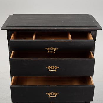 A painted chest of drawers, circa 1900.