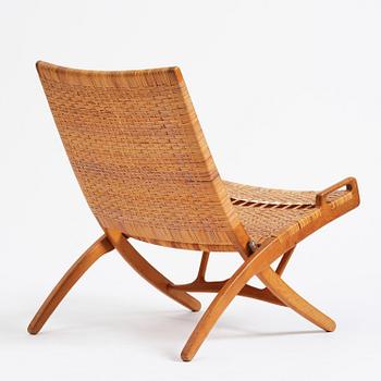 Hans J. Wegner, a foldable easy chair model 512, Johannes Hansen, Copenhagen, 1950s-60s.