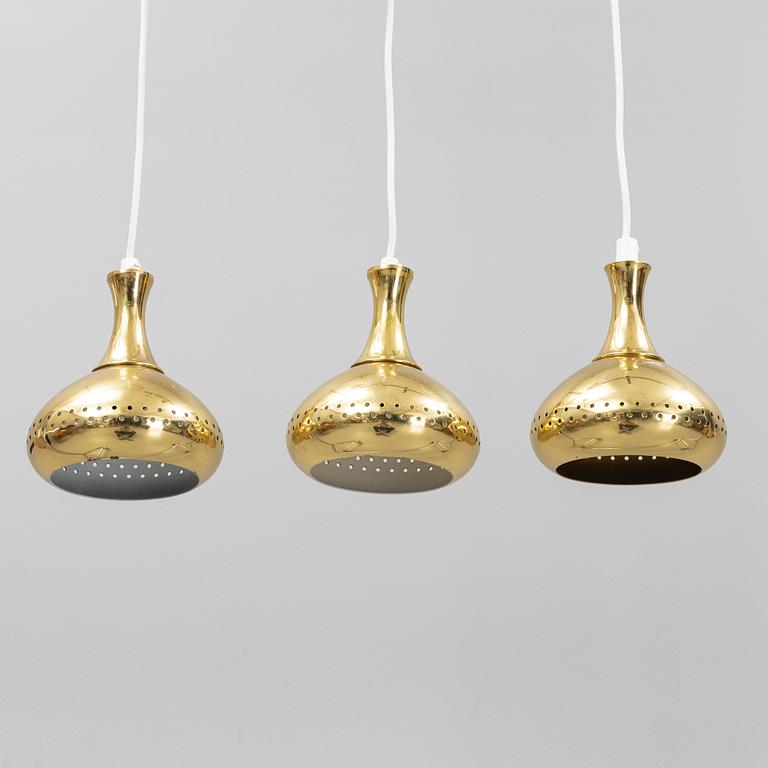 A set of three brass pendule lights, second half of the 20th Century.