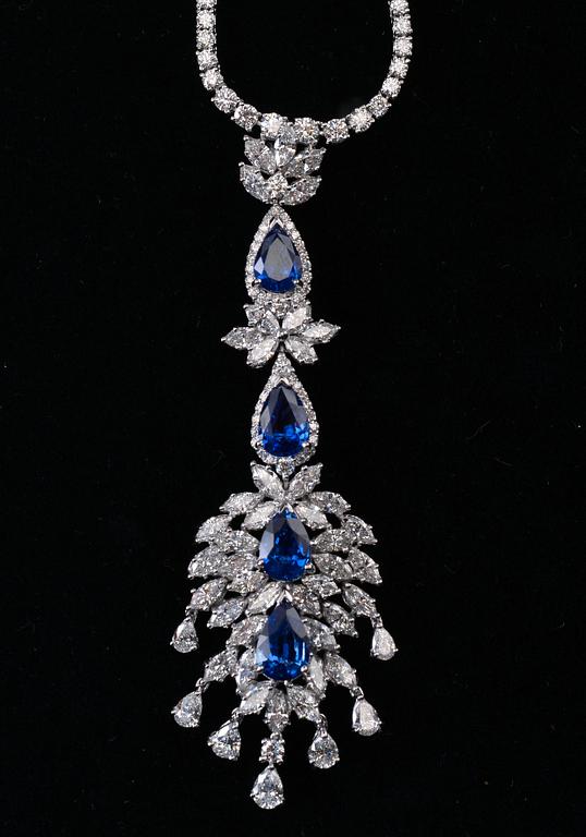 A SET OF JEWELLERY, brilliant- navette- and drop cut diamonds c. 19 ct. Ceylon sapphires c. 15 ct. Weight 49 g.