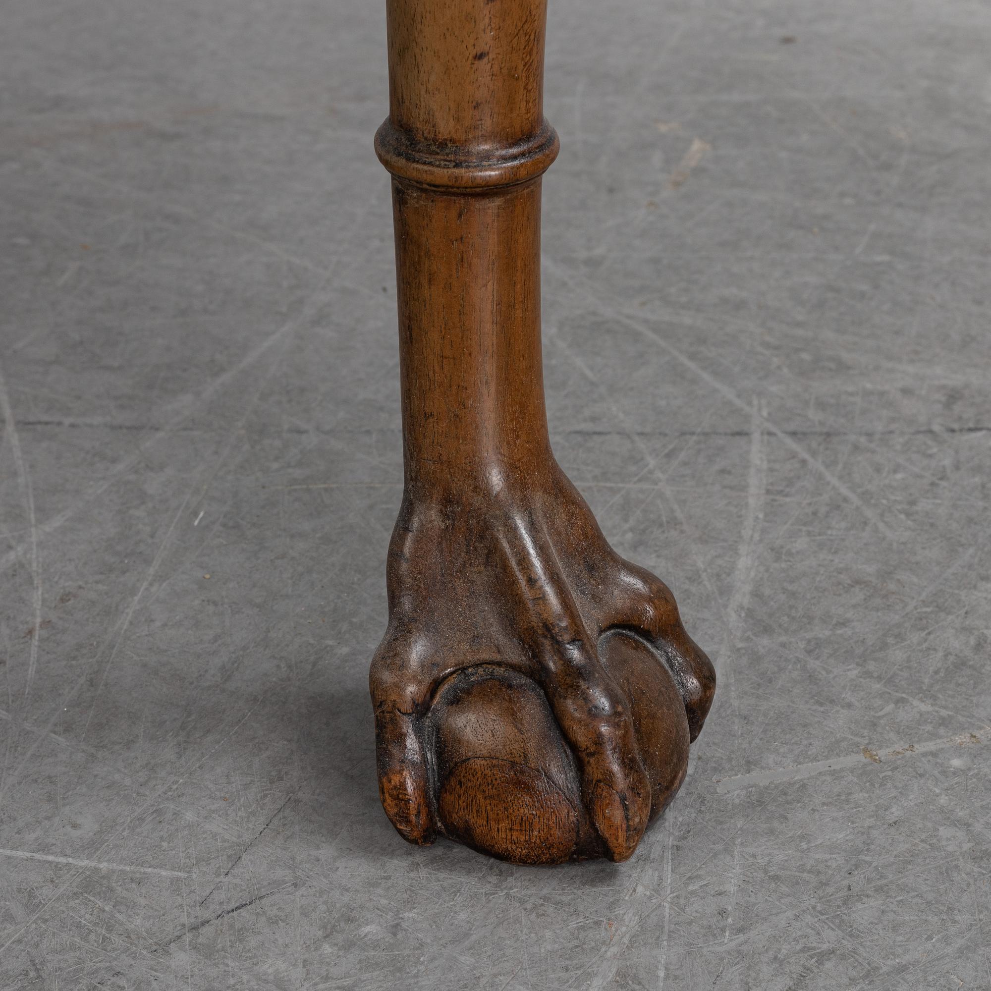 An English mahogany table, 19th Century.