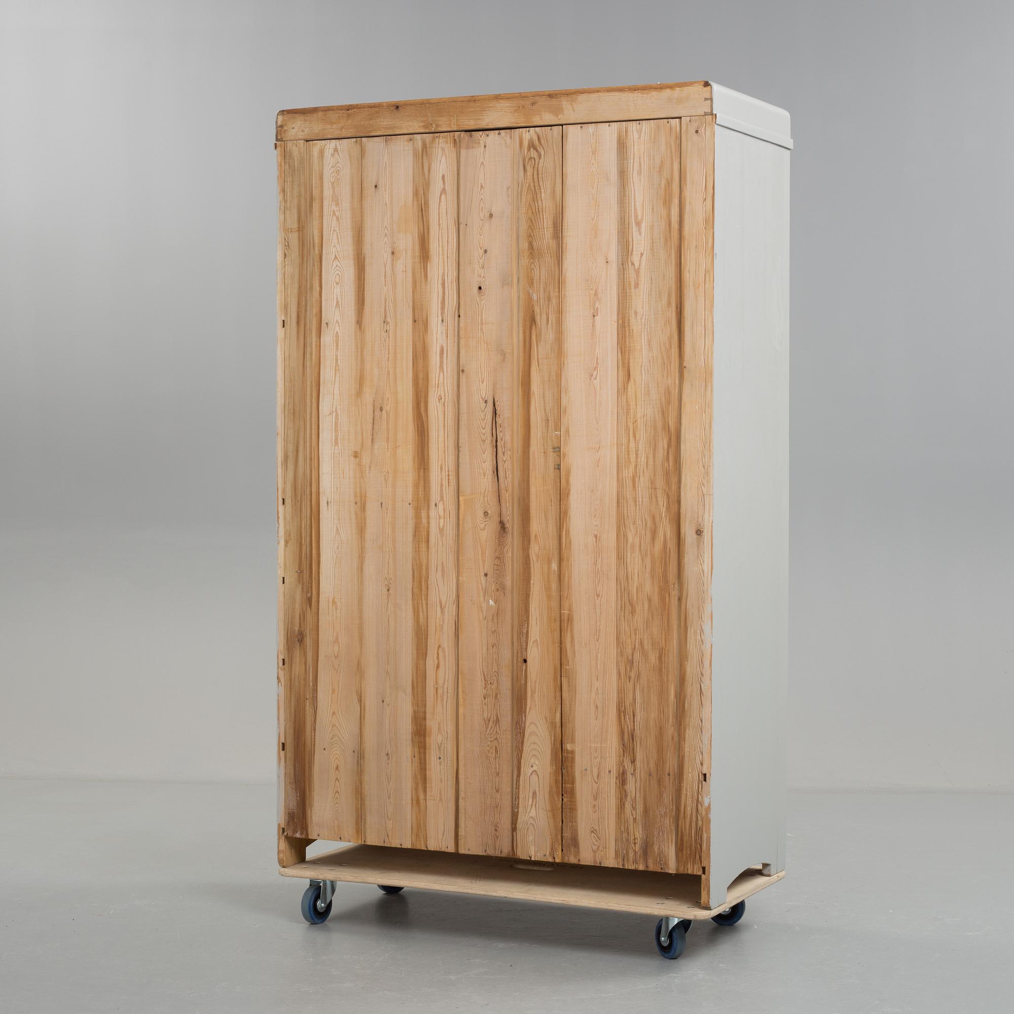 A early 20th century cabinet with mirror.