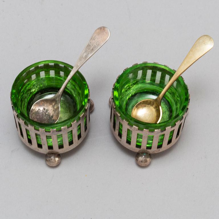 a pair of silver and galss salt cellars by CG Hallberg 1898.