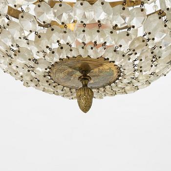 An Empire-style six-branch chandelier, circa 1900.