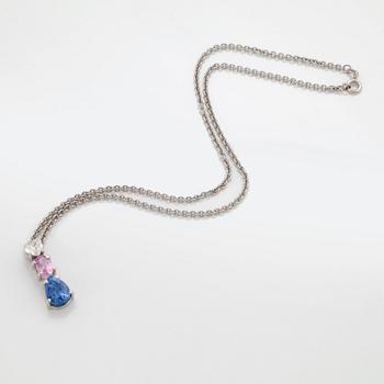 A PENDANT set with sapphires and a heart brilliant-cut diamond.