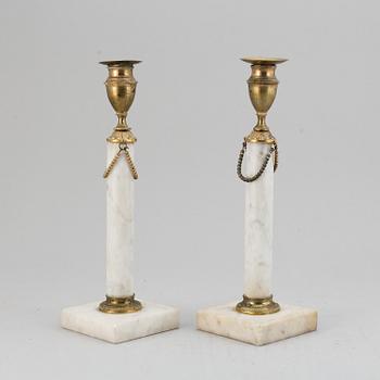 A pair of late Gustavian candle sticks.