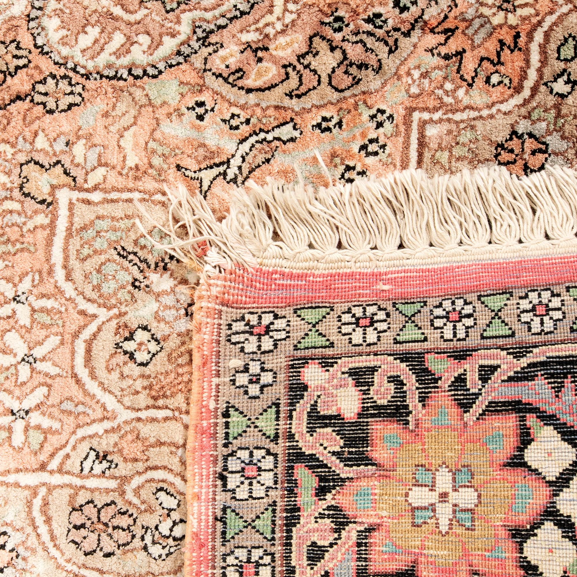 Kashmir silk rug, approximately 223x125 cm.