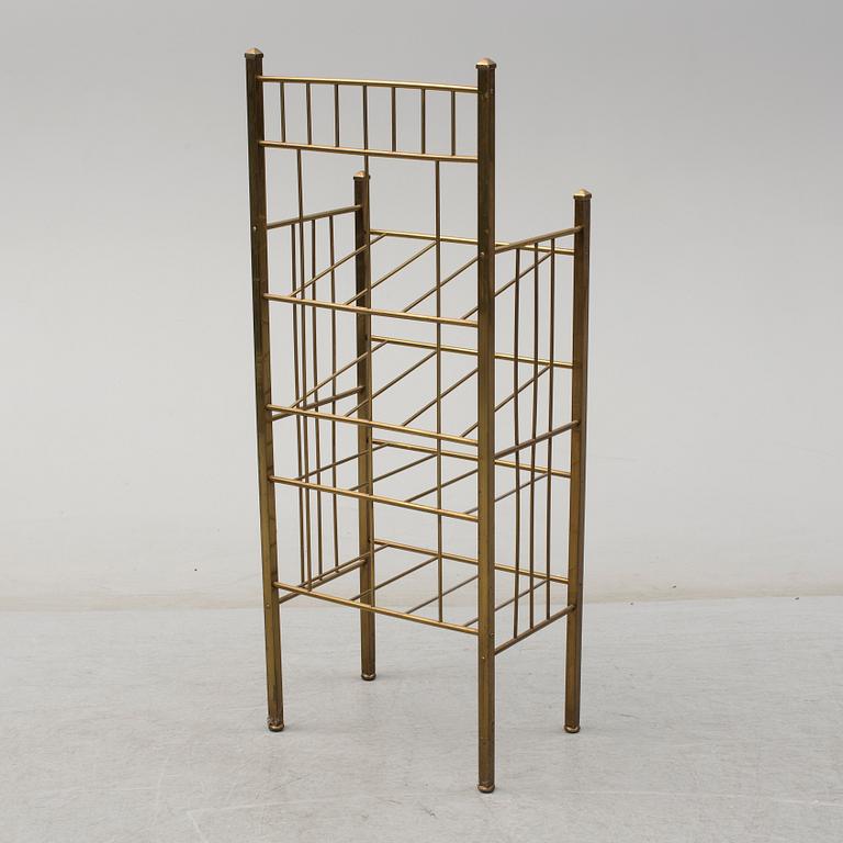 A brass shelf and two flutes, 20th century.