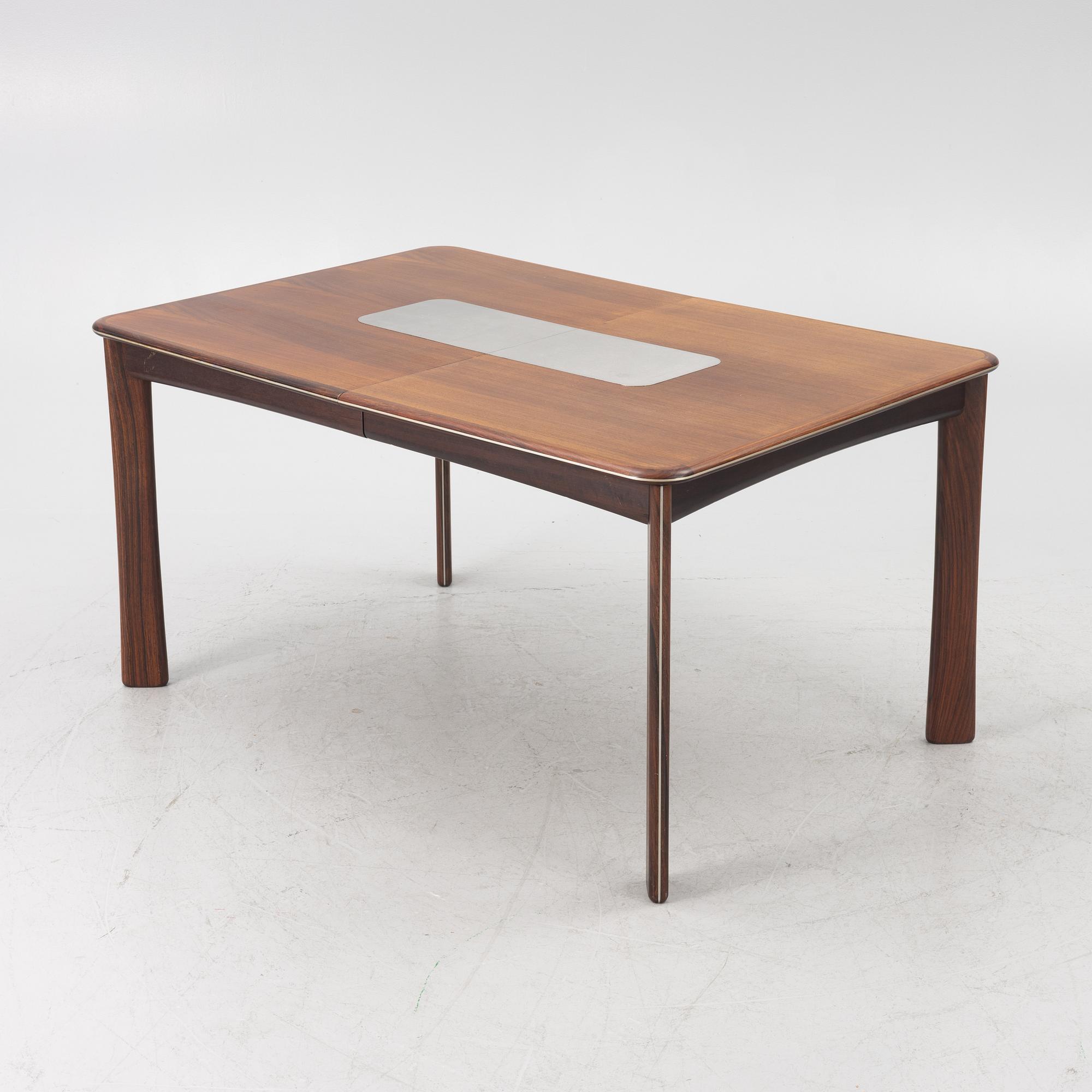 A dining table and six chairs, Uldum Møbelfabrik, Denmark, 1960's/70's.